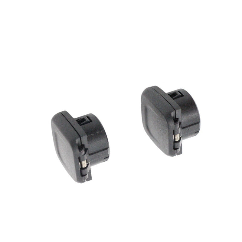 A pair of black center console power outlet covers for 2014, 2015, and 2016 for Chevrolet Silverado.