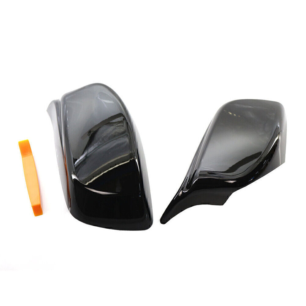 A pair of rearview mirror cover trims suitable for 2004-2007 for BMW E60/E61 models, with removal tools.