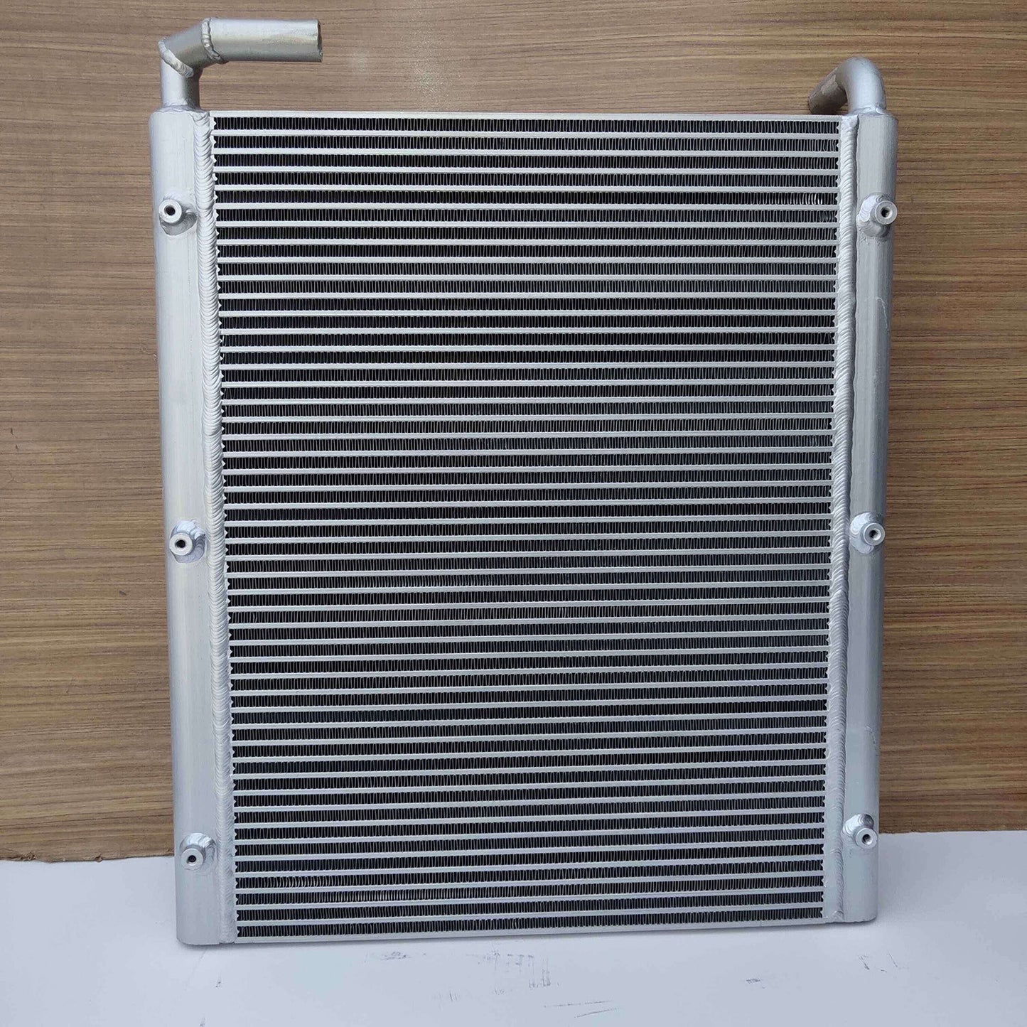 The 12452U413S7 oil cooler is suitable for Kobelco excavators SK100, SK100-1, SK100-3, and SK120-1.