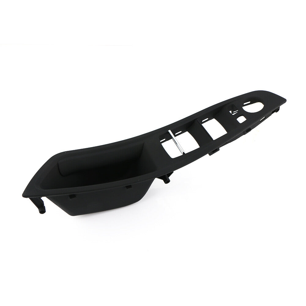 Black trim around the front right door window control panel for BMW F10