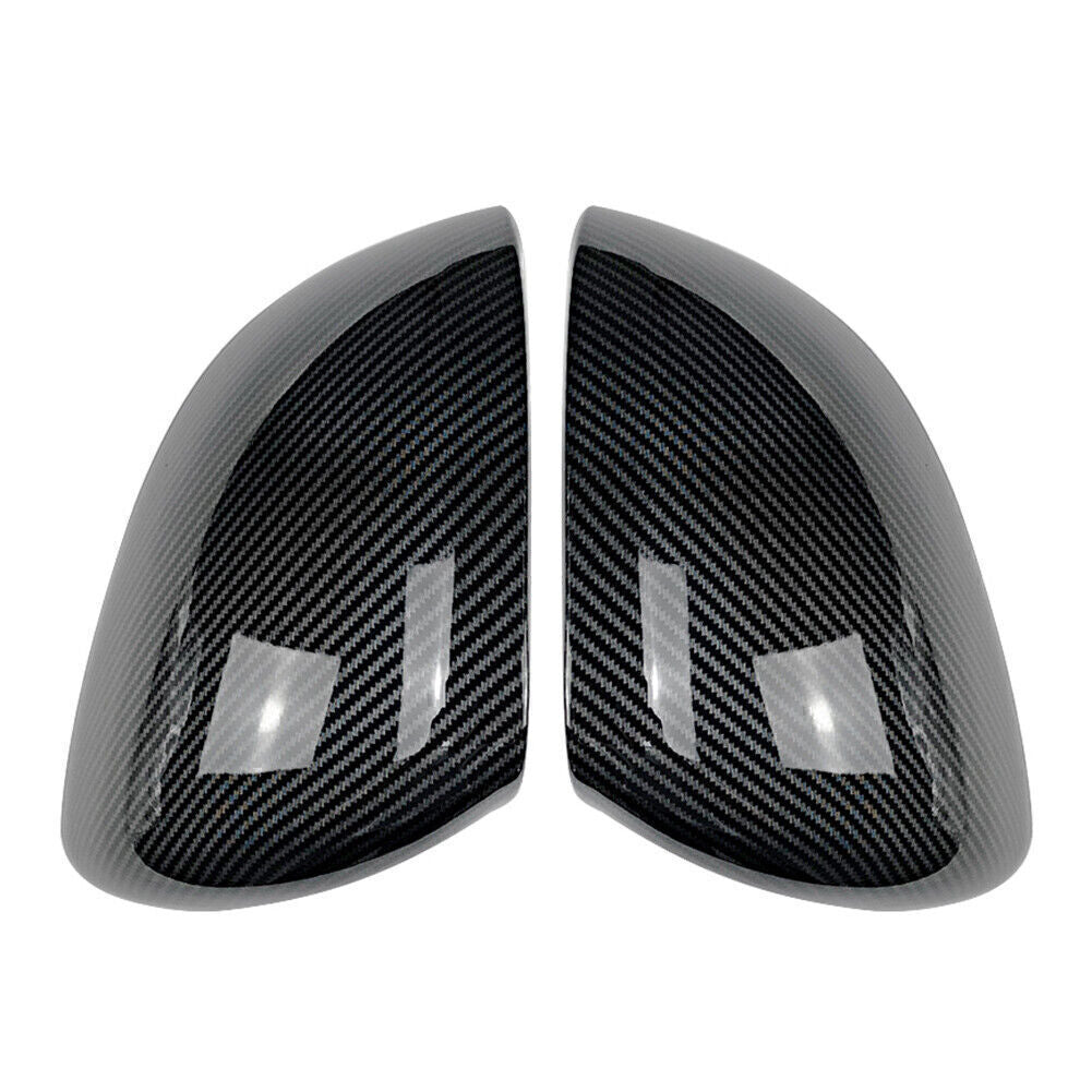 A pair of carbon fiber rearview mirror cap trims for the for Mercedes-Benz C-Class W206 BLK