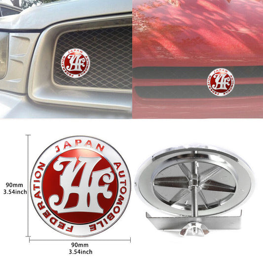 The red badge on the front of the car grille belongs to the Japan Automobile Federation and is applicable to for Subaru .