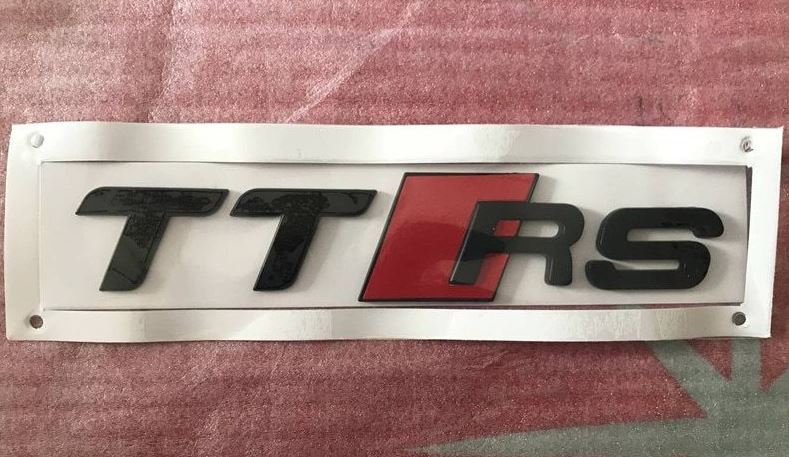 Carbon-plated side fender and window badge stickers for Volvo S40 cars.