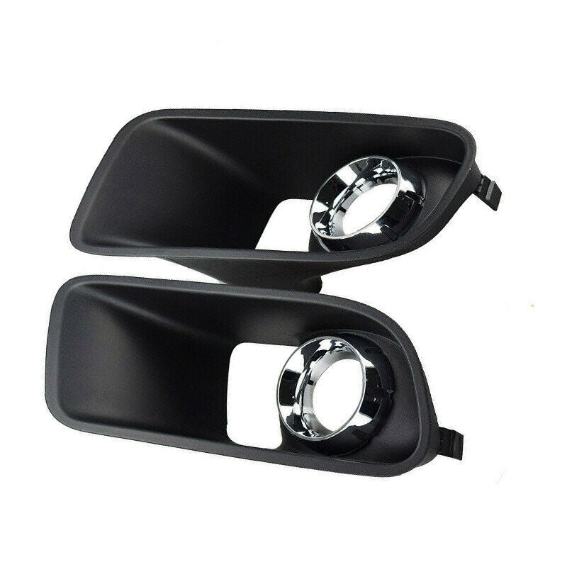 A pair of front bumper fog light covers for Dodge chargers from around 2012-2014.