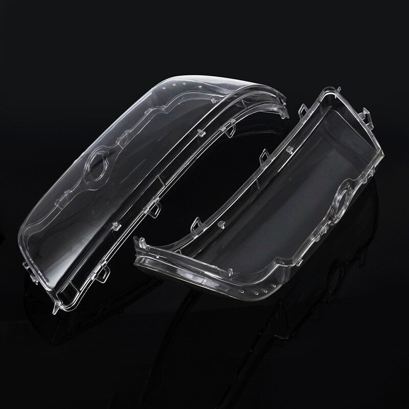 A pair of transparent headlight lens protective covers for BMW E39, 1996 - 2003.